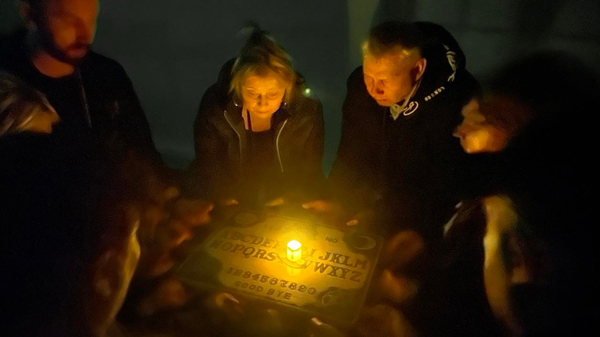 Kindred Spirit Investigations séance with group using Ouija board 